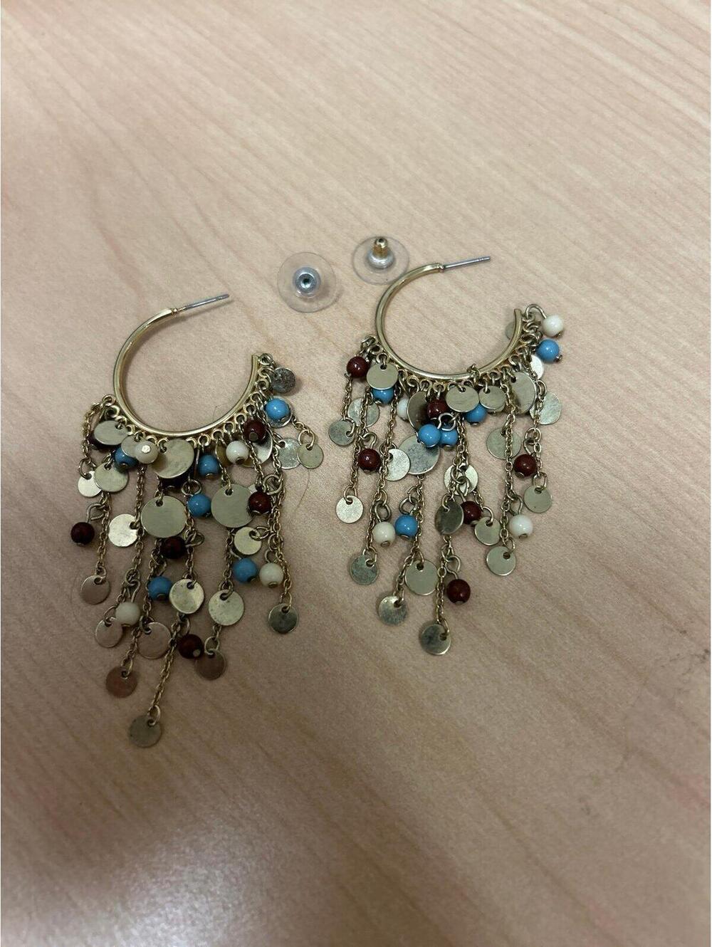 Gold-tone hoop earrings with cascading waterfall strands